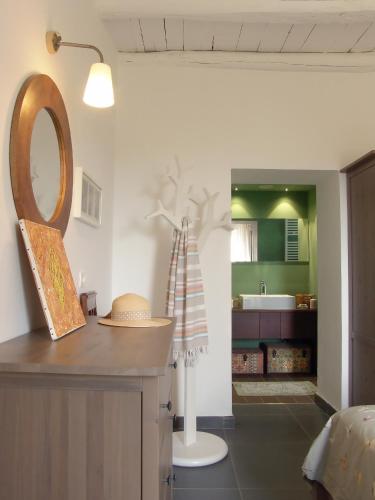 a room with a counter with a mirror and a kitchen at Luxury Easy Living in Framura in Framura