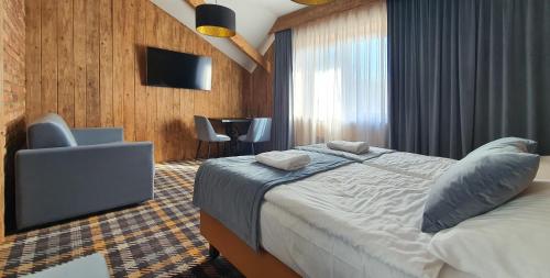 Una cama o camas en una habitación de Ranč Regetovka