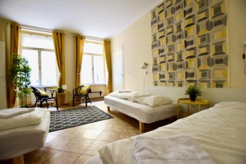 a hotel room with two beds and a window at EcoStay Apartment by the Basilica in Budapest