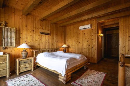 Letto o letti in una camera di Green Village Resort