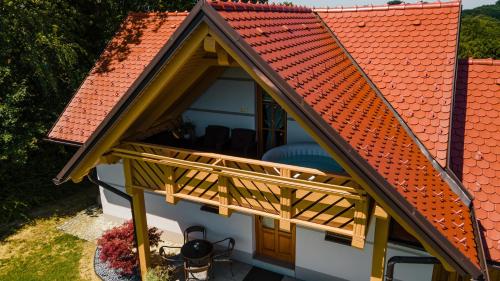 an overhead view of a house with a wooden deck at Villa VINEYARD in Velika Nedelja