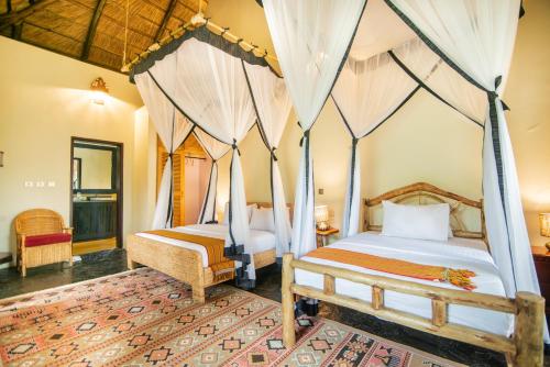 Voodi või voodid majutusasutuse Buffalo Safari Lodge toas
