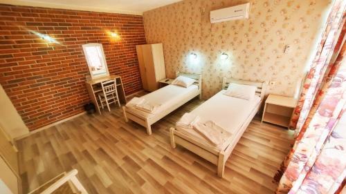 Postel nebo postele na pokoji v ubytování Hotel Divna