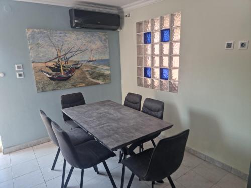 a dining room with a table and chairs at Andronike's Villa in Sami