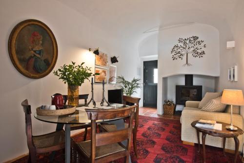 a living room with a table and a couch at Casa da Moira in Avis