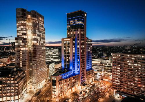 a group of tall buildings in a city at night at Waldorf Astoria Berlin in Berlin