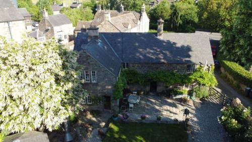 an aerial view of a house with a roof at Sycamore cottage in Matlock