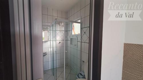 a shower with a glass door in a bathroom at Recanto Da Val in São Francisco do Sul