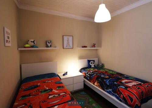 Ένα ή περισσότερα κρεβάτια σε δωμάτιο στο MyStay - Refúgio dos Sonhos