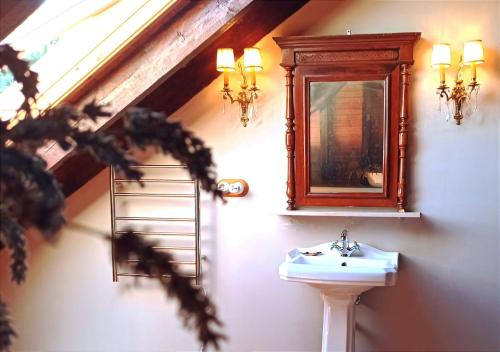 a bathroom with a sink and a mirror at Santa Emilia in Mondoñedo