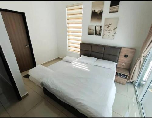 Katil atau katil-katil dalam bilik di Crystal Luxury House 高级水晶屋 Near Jonker street
