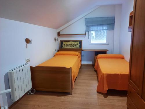 Postel nebo postele na pokoji v ubytování Casa da Xesteira-Merexo-Muxía-Costa da Morte