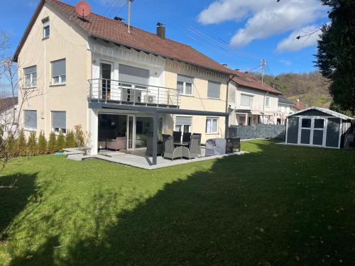 a large house with a large lawn in front of it at Nita in Frickenhausen