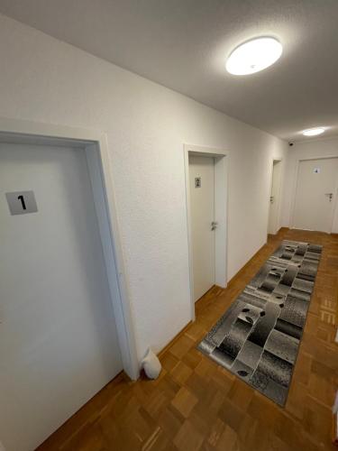 an empty room with a rug on the floor at Nita in Frickenhausen