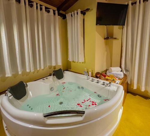 a bath tub filled with a green substance at Cloud Nine Wilpattu by Aaradhya in Wilpattu