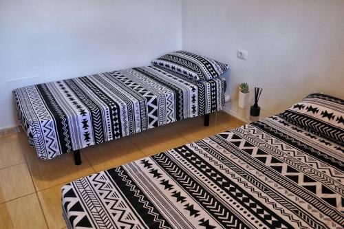 Ένα ή περισσότερα κρεβάτια σε δωμάτιο στο Bel appartement calme vue mer et montagne
