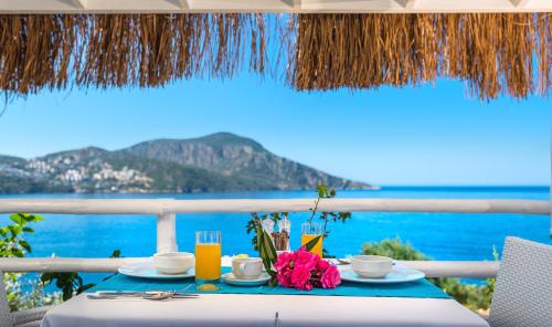 a table with a view of the ocean at Likya Pavilion Hotel in Kas