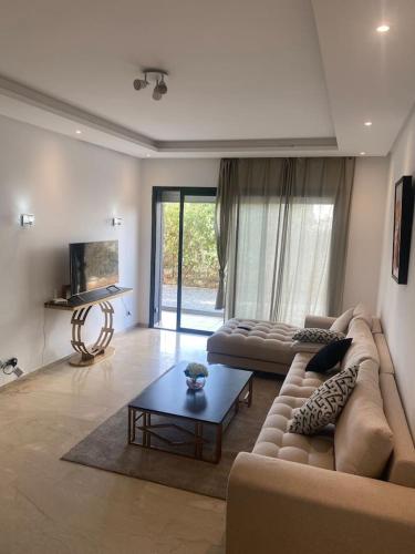 Un lugar para sentarse en Prestigia 3 Bedrooms with swimming pool