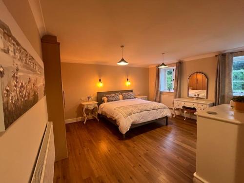 a bedroom with a large bed in a room at The Annex at Merley Mews in Poole