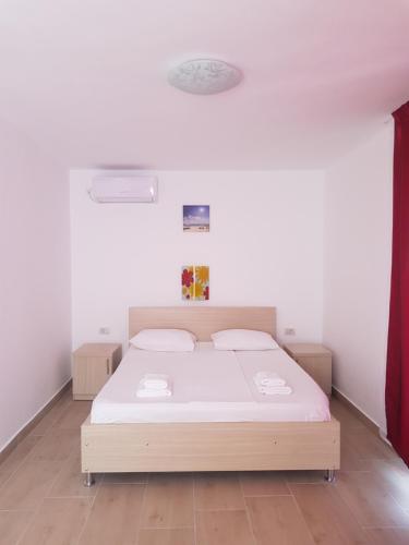 Ένα ή περισσότερα κρεβάτια σε δωμάτιο στο EVANA HOUSE