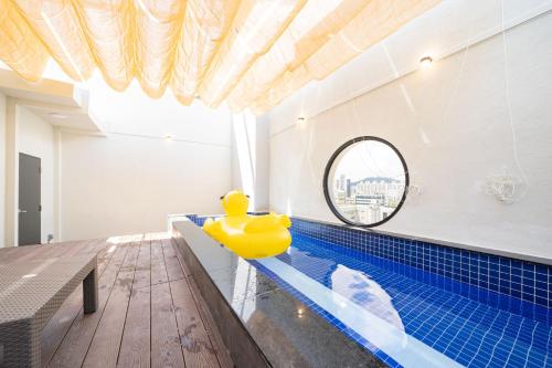 a pool with a rubber duck in the middle of a house at Cloud in Hotel Mokpo Peace Square in Mokpo