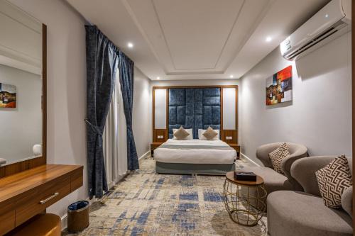 En eller flere senge i et værelse på ال متعب سويتس اليرموك 2