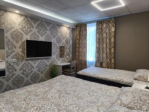 Postel nebo postele na pokoji v ubytování APARTHOTEL