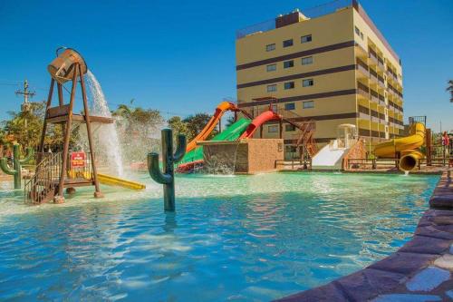 a water park with a water slide and slides at BARRETOS COUNTRY in Barretos
