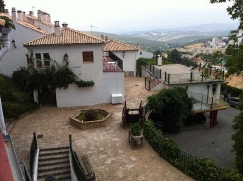 a view of a house with a patio and stairs at Villa Turística de Cazorla in Cazorla