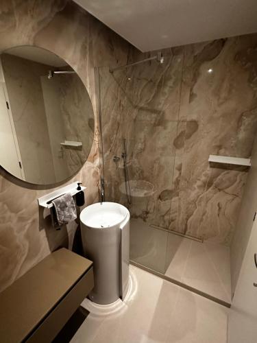 a bathroom with a toilet and a shower at Luxury PENTHOUSE at the Historical Centre with free parking in Bratislava