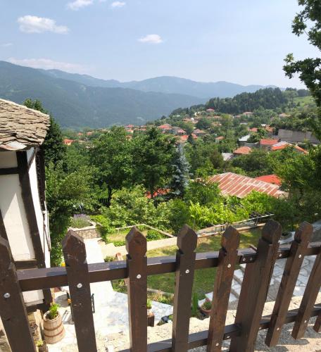 a wooden fence with a view of a city at ΤΟ ΑΡΧΟΝΤΙΚΟ in Kríkellon