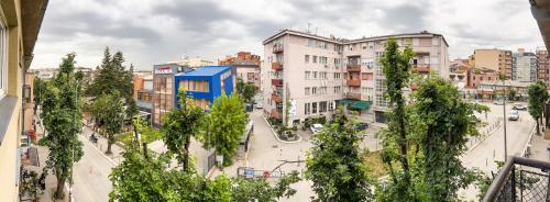 a view of a city with buildings and trees at D&D Apartment in Prishtina in Pristina