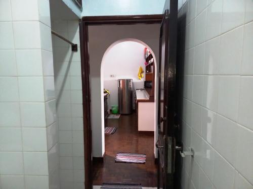 a hallway with an open door to a room at Gia Apartment in Shanzu