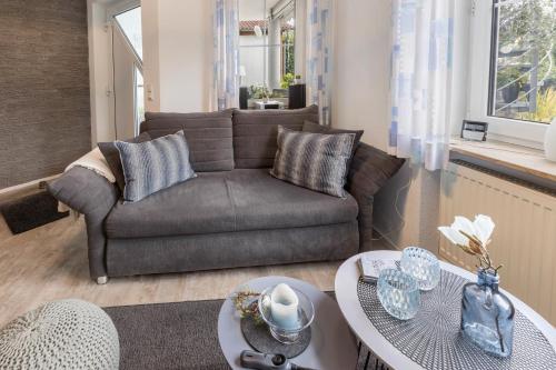 a living room with a couch and a table at Griesbaum in Tengen