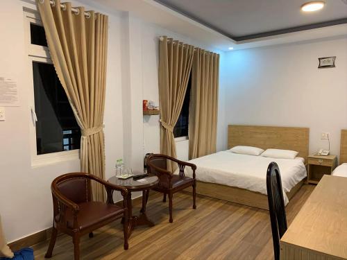 Postel nebo postele na pokoji v ubytování Dang Nguyen Guesthouse