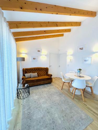 a living room with a couch and a table at Douro Pateo House in Vila Nova de Gaia