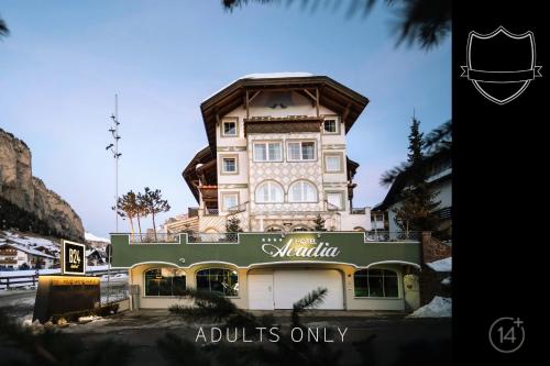 a building with a sign that reads adjuncts only at Hotel Acadia - Adults Mountain Home in Selva di Val Gardena