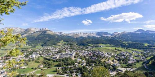 an aerial view of a town in the mountains at Appartement Balcon Villard-de-lans in Villard-de-Lans