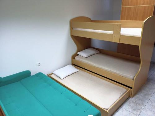 a small room with two bunk beds in it at Room 400 m from the beach in Izola