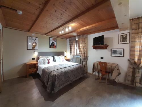 Postel nebo postele na pokoji v ubytování Hotel Astoria