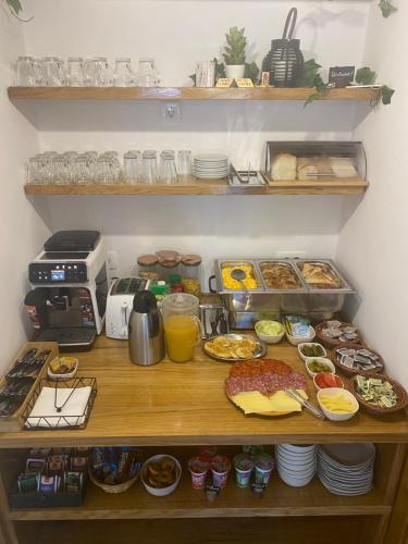 a shelf with food and drinks and other food items at House Flora in Rastovača