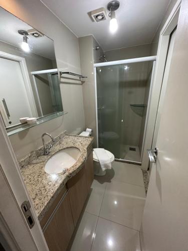 a bathroom with a sink and a shower and a toilet at VG FUN-OCEAN VIEW BEACH FRONT APARTMENT-Fortaleza in Fortaleza