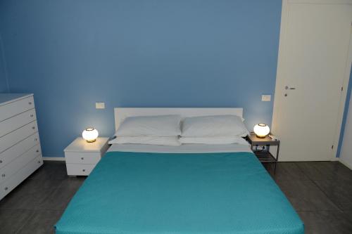 Postel nebo postele na pokoji v ubytování Gialu: il tuo alloggio dentro le mura