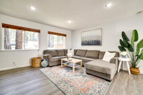 a living room with a couch and a table at half Mi to Lake Tahoe Pet-Friendly Cabin in South Lake Tahoe