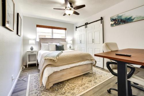 a bedroom with a bed and a desk and a table at Pet-Friendly South Lake Tahoe Vacation Rental! in South Lake Tahoe