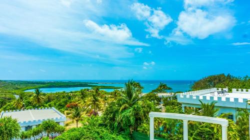 a view of the ocean from the balcony of a resort at Castles In Paradise Villa Resort in Vieux Fort
