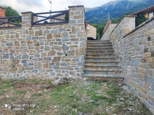 a set of stone stairs in a stone wall at Villa Vakalis in Ioannina