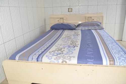 En eller flere senge i et værelse på Motel Cité des Amis