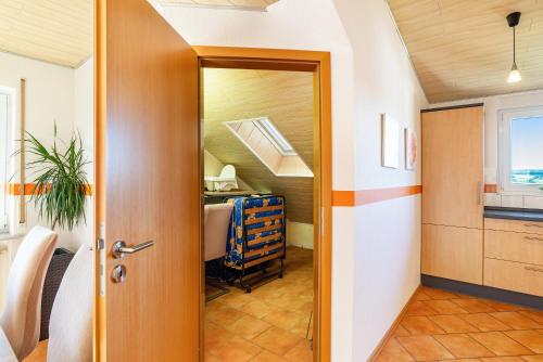 a hallway with a door leading to a room at Hügelblick Oase in Kraichtal
