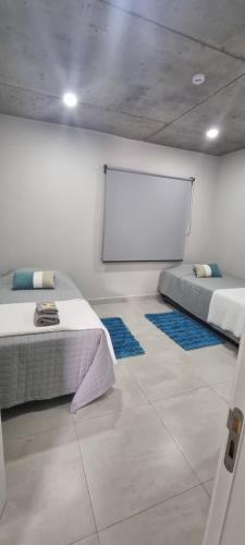 Katil atau katil-katil dalam bilik di Tranquilo dpto. zona aeropuerto!!!